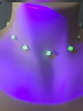 Handmade floating-style choker featuring glowing uranium glass beads